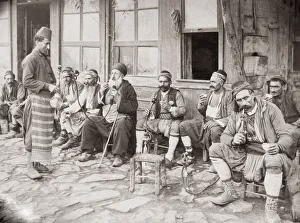 Men smoking hookah pipes outside a Turkish cafe, Turkey. c.1880's Men smoking hookah pipes outside a Turkish cafe, Turkey. c.1880's