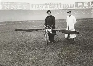 Man Powered Prints: Men Standing with Bi-Cycle Aircraft with Adverts in Fren?