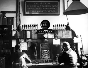 Operators Prints: Men working at watchroom telephone switchboard