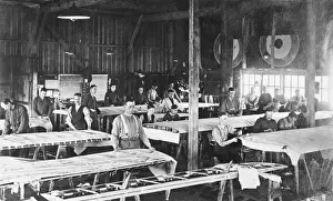 Men Working on Wing in the Fabric Covering Workshop at t?