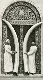 Images Dated 7th August 2018: Men of Zanzibar holding large tusks, Tanzania, East Africa