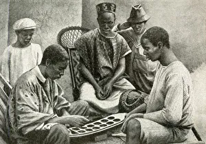 Images Dated 7th August 2018: Mende men playing Warri, Gold Coast, West Africa