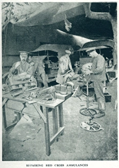 Ambulances Gallery: Mending Red Cross ambulances 1916