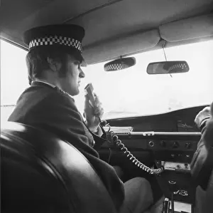 Met Police officer on his car radio