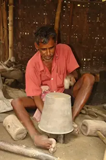 Mallet Prints: Metal worker at Matiari, West Bengal, India