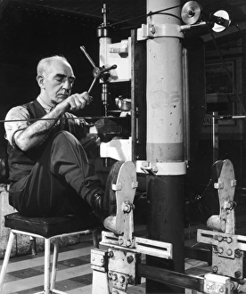 Precision Gallery: A metalworker operating a drill