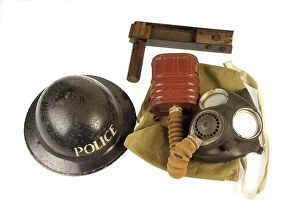 Metropolitan Police gas mask, bag, rattle and tin helmet