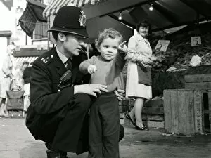 Images Dated 16th February 2011: Metropolitan Police officer and child