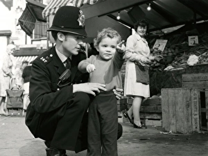 Images Dated 16th February 2011: Metropolitan Police officer and child
