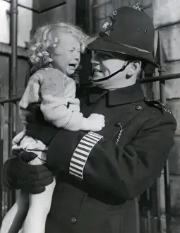 Metropolitan Police officer and crying child