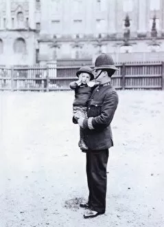 Images Dated 4th February 2011: Metropolitan Police officer and lost boy