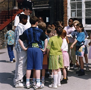 Images Dated 4th February 2011: Metropolitan Police officer in school playground