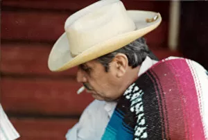 Poncho Collection: Mexican man with cigarette and hat