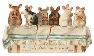 Six mice on a table on a cutout Christmas card