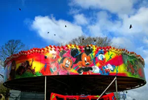 Mickey Mouse characters on a fairground roundabout