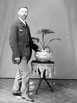 Uncomfortable Prints: Middle aged man with potted palm, Mid Wales