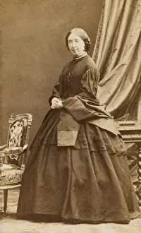 Middle-aged Victorian woman in a dark crinoline dress