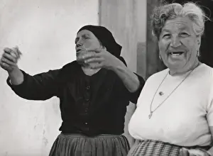 Two middle aged women having a laugh