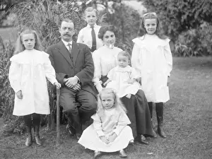 Middle class family group in a garden, Mid Wales