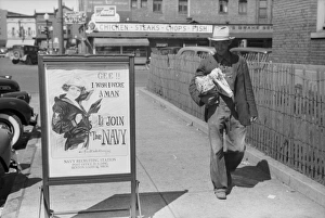 Migrant fruit worker from Arkansas walking by the post offic Migrant fruit worker from Arkansas walking by the post offic