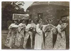 Mikado cast members in kimonos with fans