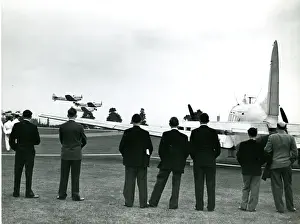 Wisley Prints: Three Miles Magisters fly past the de Havilland Dove, G-?
