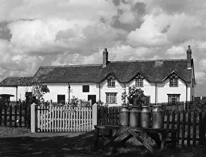 Dunkirk Prints: Milk churns outside a pictureque farmhouse called Dunkirk Farm