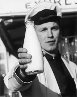 Milkman Holds Bottle