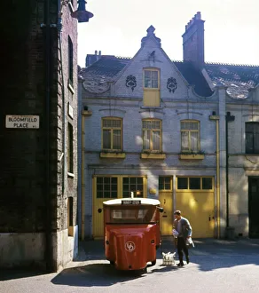 Garage Gallery: Milkman and milk float, London