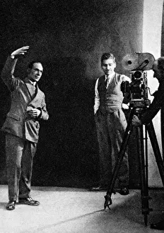 Deaf Prints: Miming a gesture, the method of registering sunshine, posed