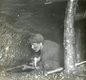 Seam Prints: Miner cutting coal in a narrow seam, South Wales