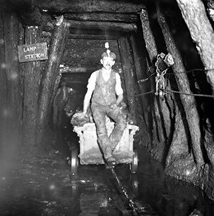 Mining Collection: Miner riding drams, Tirpentwys Colliery, South Wales