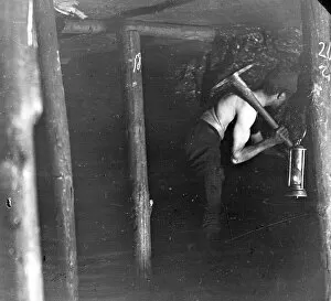 Mine Gallery: Miner working in a coal seam, South Wales