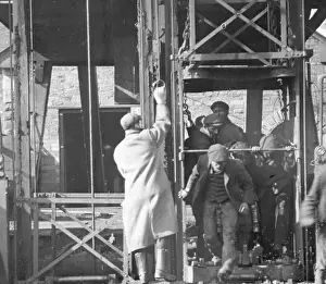 Miners getting out of a shaft lift, South Wales