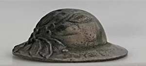 Ypres Gallery: A miniature British Brodie helmet with laurel leaves
