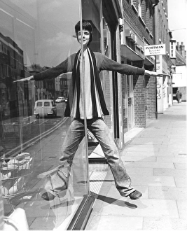 Images Dated 31st August 2016: Mirror image student doing Harry Worth mirror trick