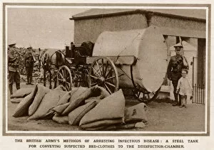 A mobile, military washing machine being guarded by troops