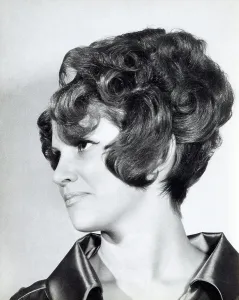 Curl Prints: A model with hair coiffured with an elaborate curl effect