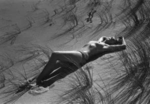 Dunes Prints: Model reclining in the sand dunes