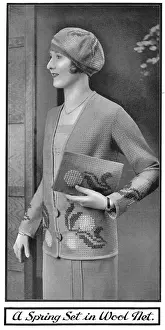 Matching Prints: Model wearing an embroidered jacket and carrying a matching embroidered pochette