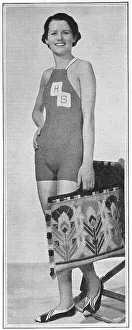 Tapestry Prints: Model wearing a knitted bathing costume with HS monogram