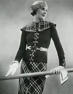 Belted Prints: Model wearing tartan skirt and jacket