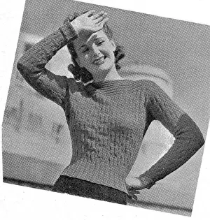 Model wearing tight knitted sweater in fancy rib stitch. Date: 1940