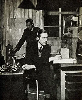 Monitoring radio stations for news to rush to editors Date: 1941 Monitoring radio stations for news to rush to editors Date: 1941