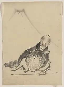 A monk reclining, holding a large conical hat in front of hi