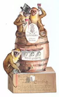Images Dated 3rd December 2015: Three monkeys with barrel on a cutout Christmas card