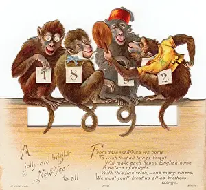Four monkeys on a cutout New Year card