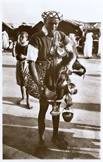 Containers Prints: Moroccan water carrier with containers and bell