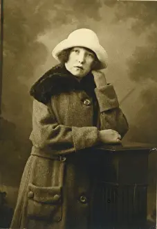Jan21 Prints: A rather morose looking young woman poses for a studio photograph. Date: c. 1923