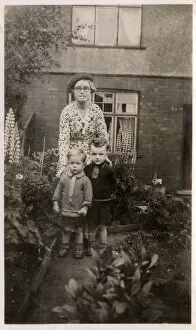 Mother and her two boys in the garden